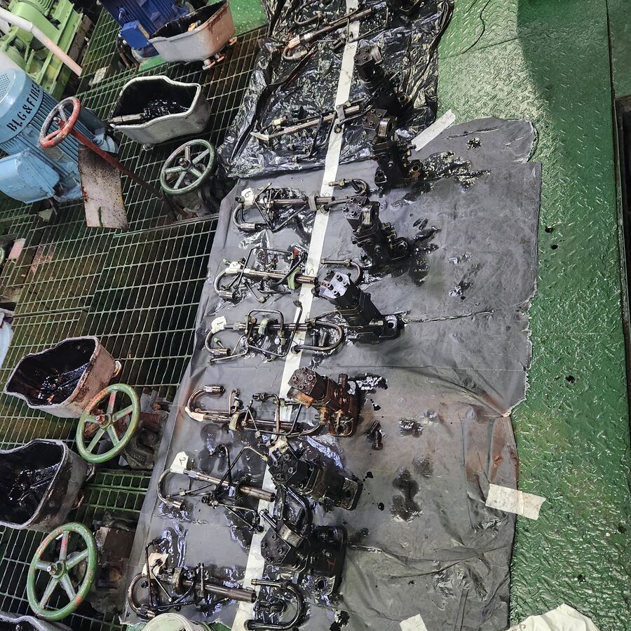 Engine components laid out for inspection