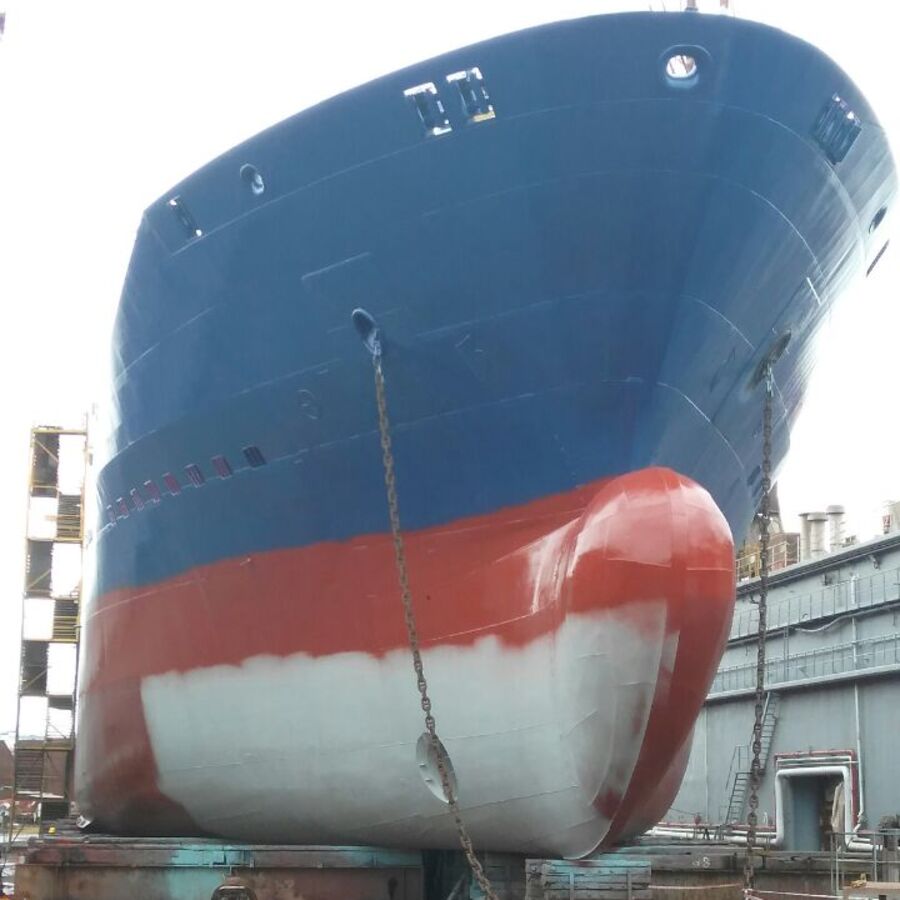 Freshly painted bow of a vessel in dry dock